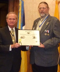 WVSSAR president Steven D. Hart presents the Chapter Charter to president Jay Frey at the organizational dinner.